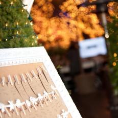 Wedding Seat Assignments Clothes Pinned to Decorative Cream Frame 