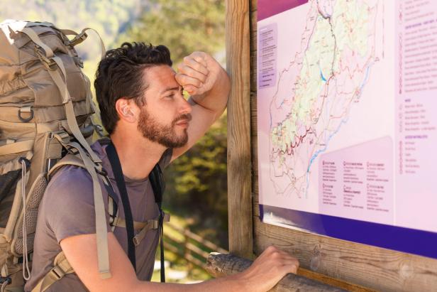 hiker studying the map hiker studying the map