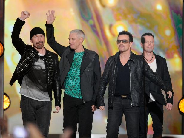 LAS VEGAS, NV - MAY 22:  Musicians The Edge, Bono, Larry Mullen Jr. and Adam Clayton of the band U2 accept the Touring Top Artist Award onstage during the 2011 Billboard Music Awards at the MGM Grand Garden Arena May 22, 2011 in Las Vegas, Nevada.  (Photo by Ethan Miller/Getty Images for ABC)